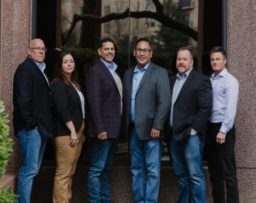 Six First Nations Pallet Solutions and Ha'no:wa:h leaders standing together outside an office building in Atlanta.