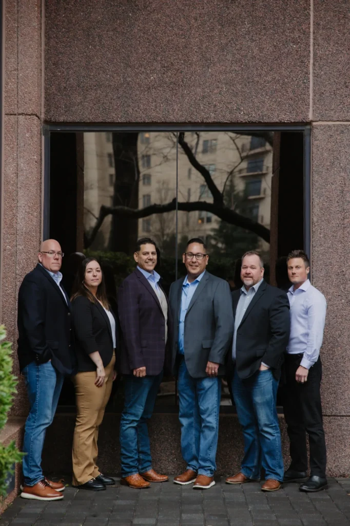 Six First Nations Pallet Solutions and Ha'no:wa:h leaders standing together outside an office building in Atlanta.